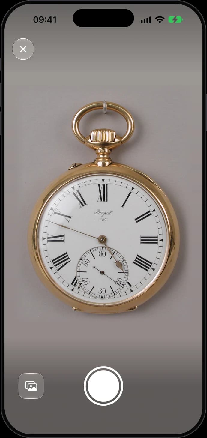 Camera framing a gold pocket watch